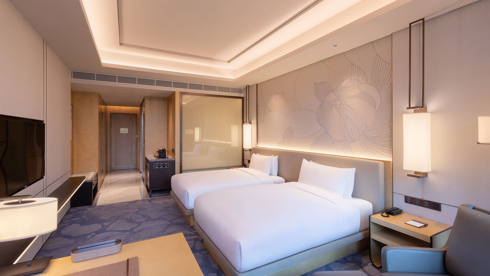 a hotel room with two beds