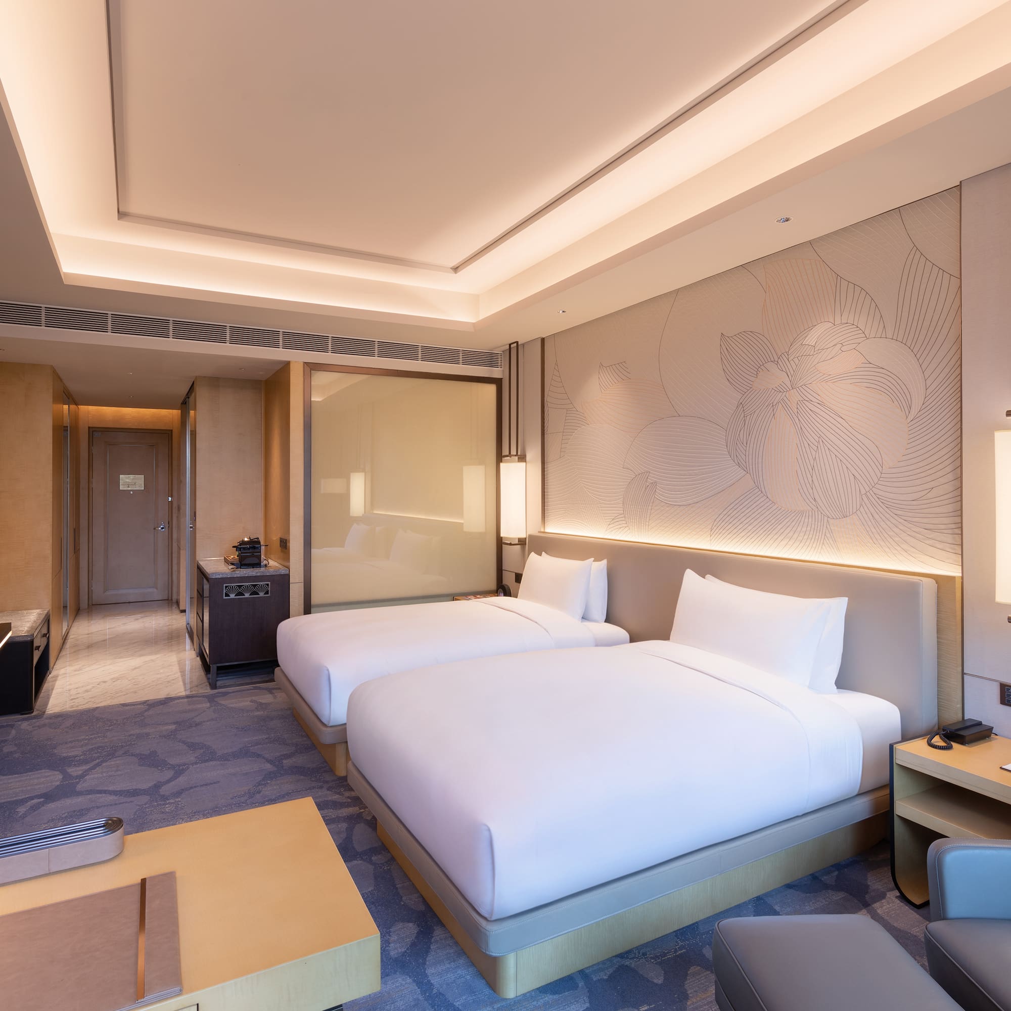 a hotel room with two beds