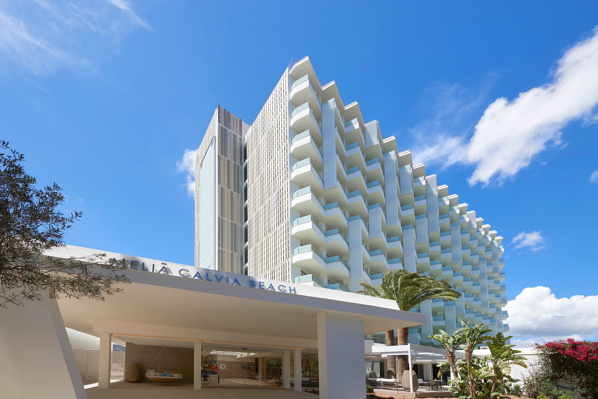 Meliá Calviá Beach hotel entrance, modern white building with balconies.