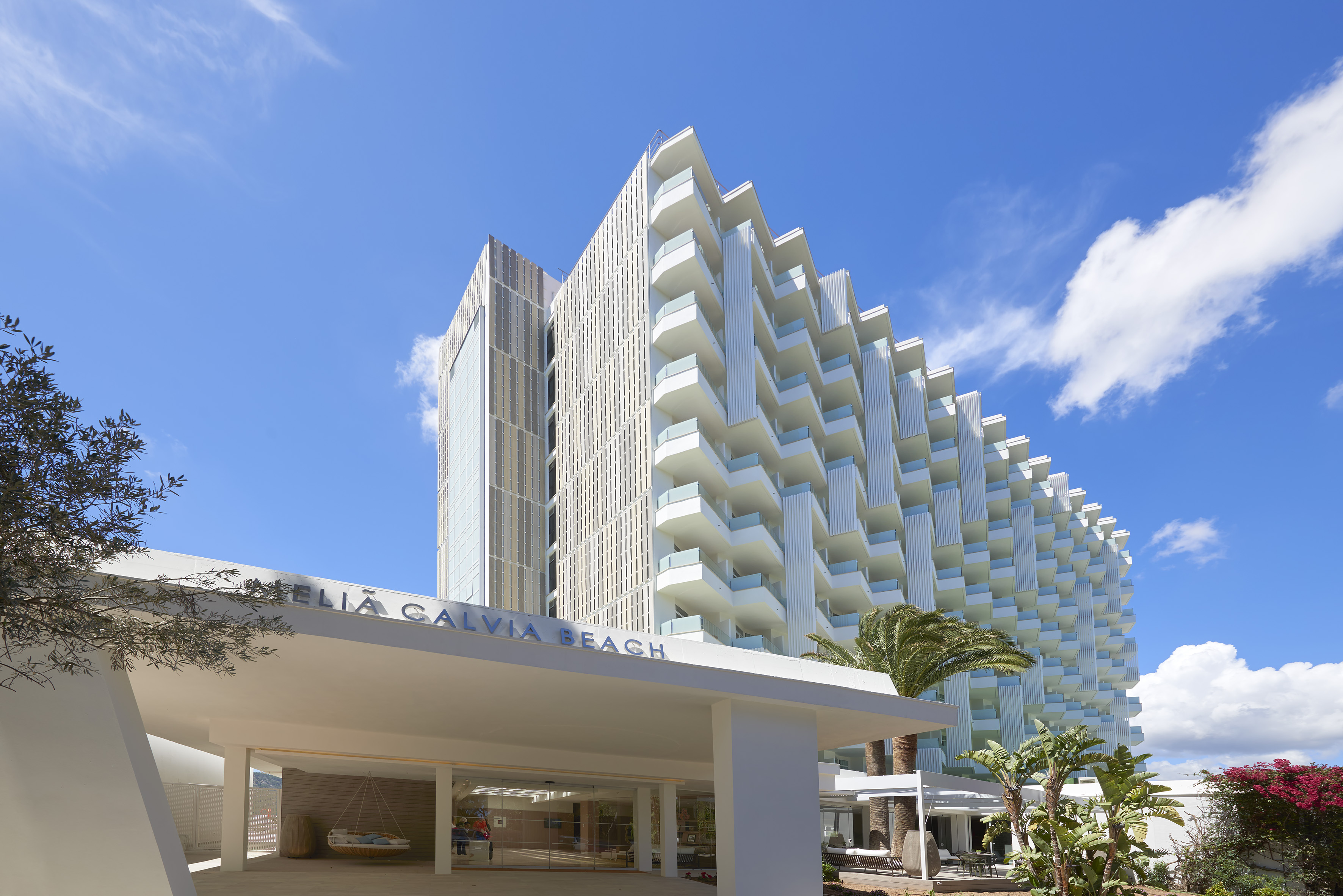 Meliá Calviá Beach hotel entrance, modern white building with balconies.