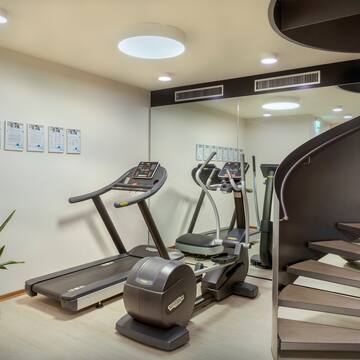 a room with treadmills and stairs