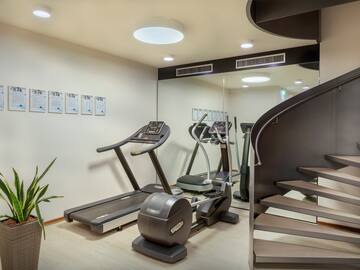 a room with treadmills and stairs