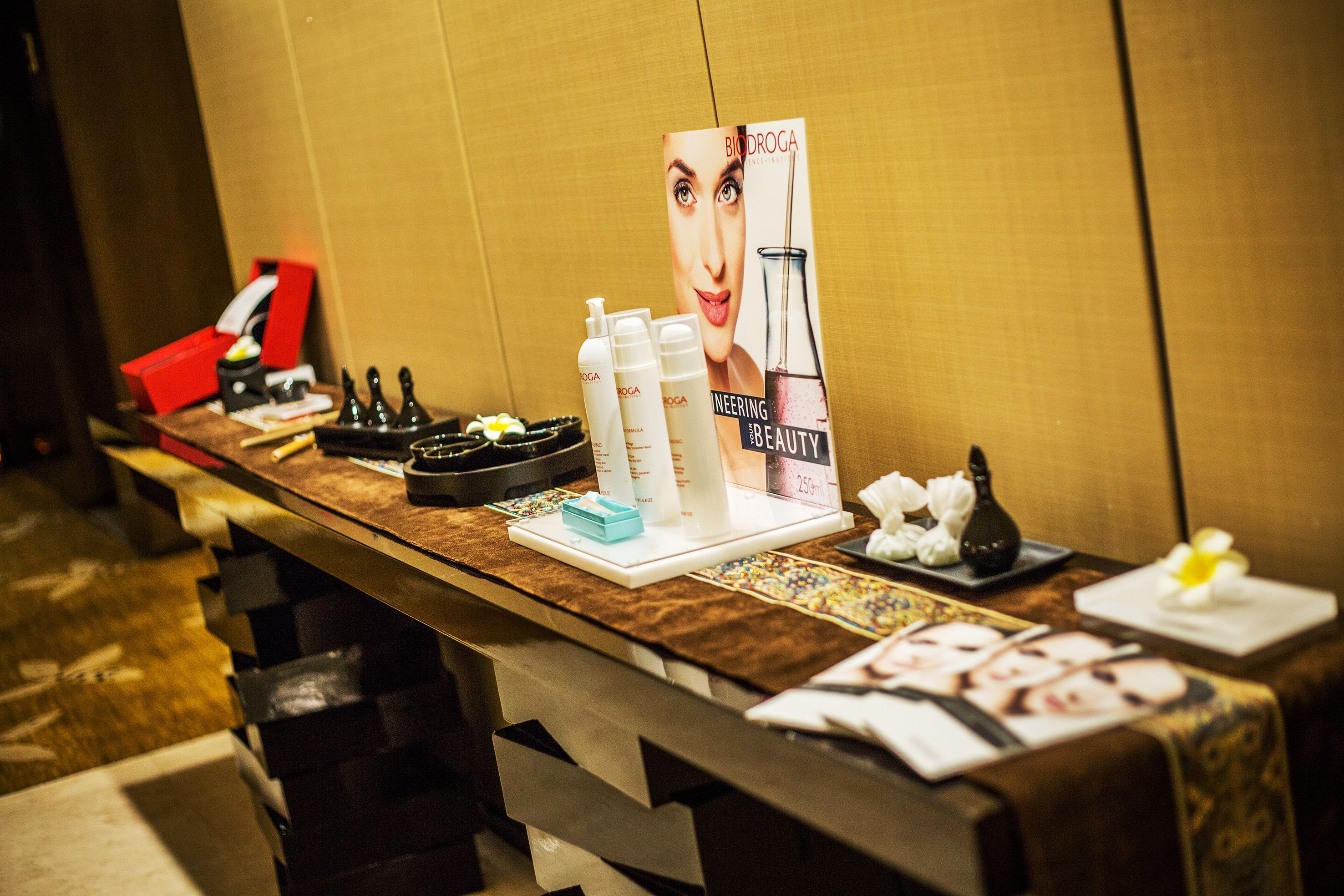 Biodroga skincare display with spa products and marketing materials.