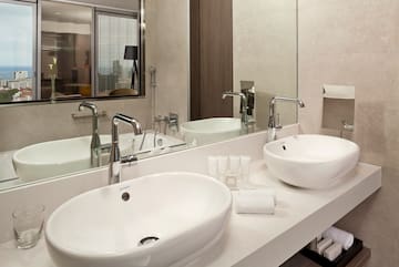 a bathroom with two sinks and a mirror