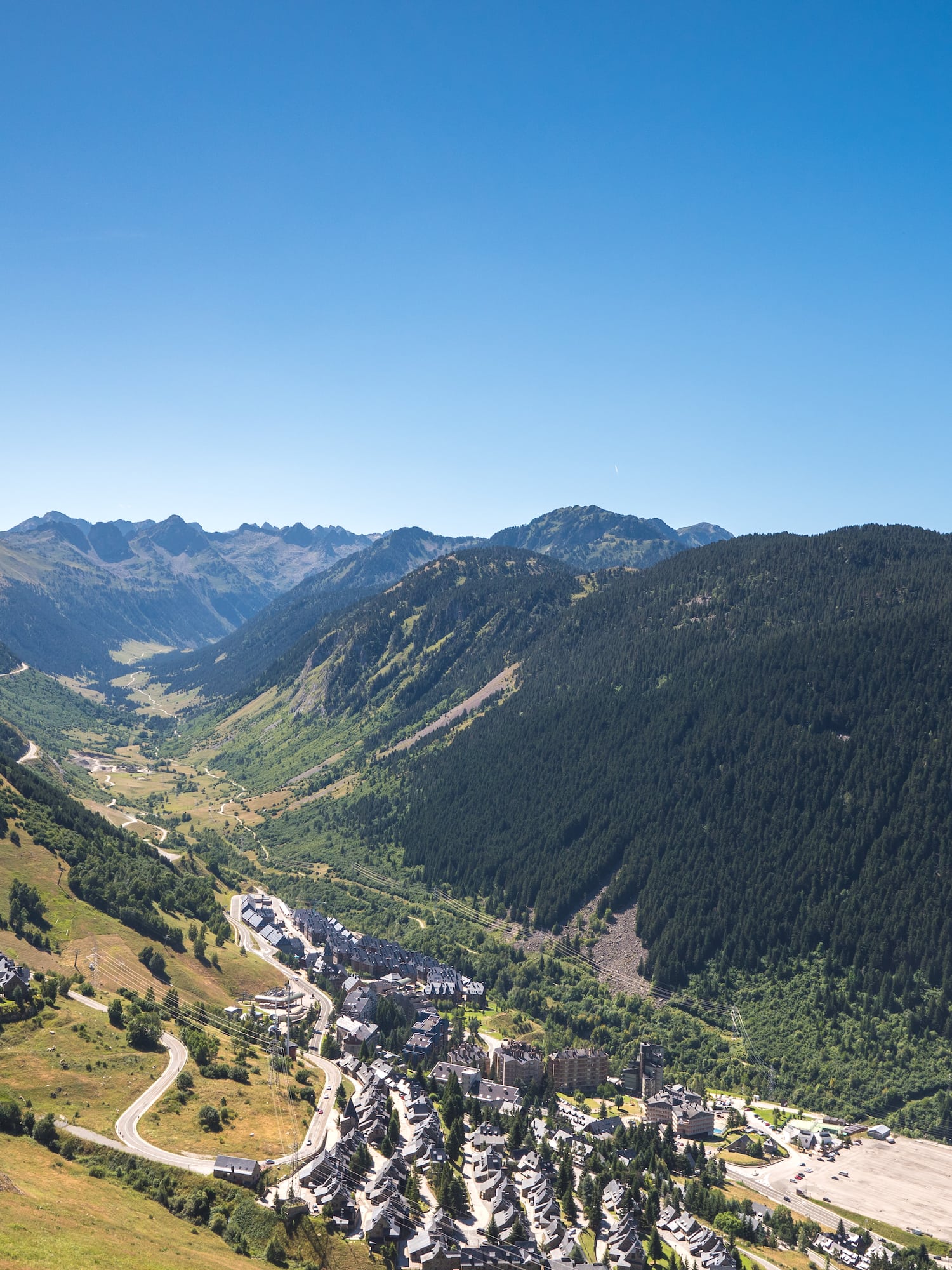 a valley with a town and mountains