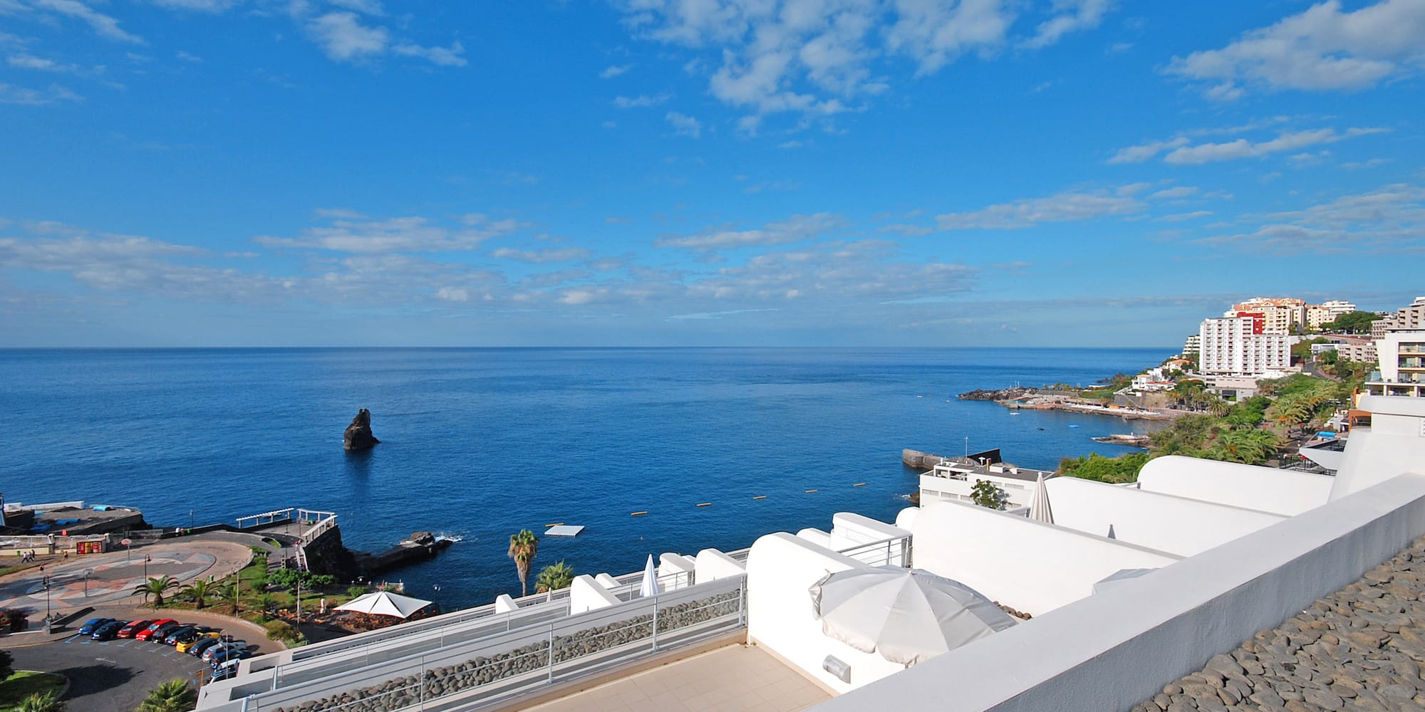 a view of a body of water from a rooftop of a building