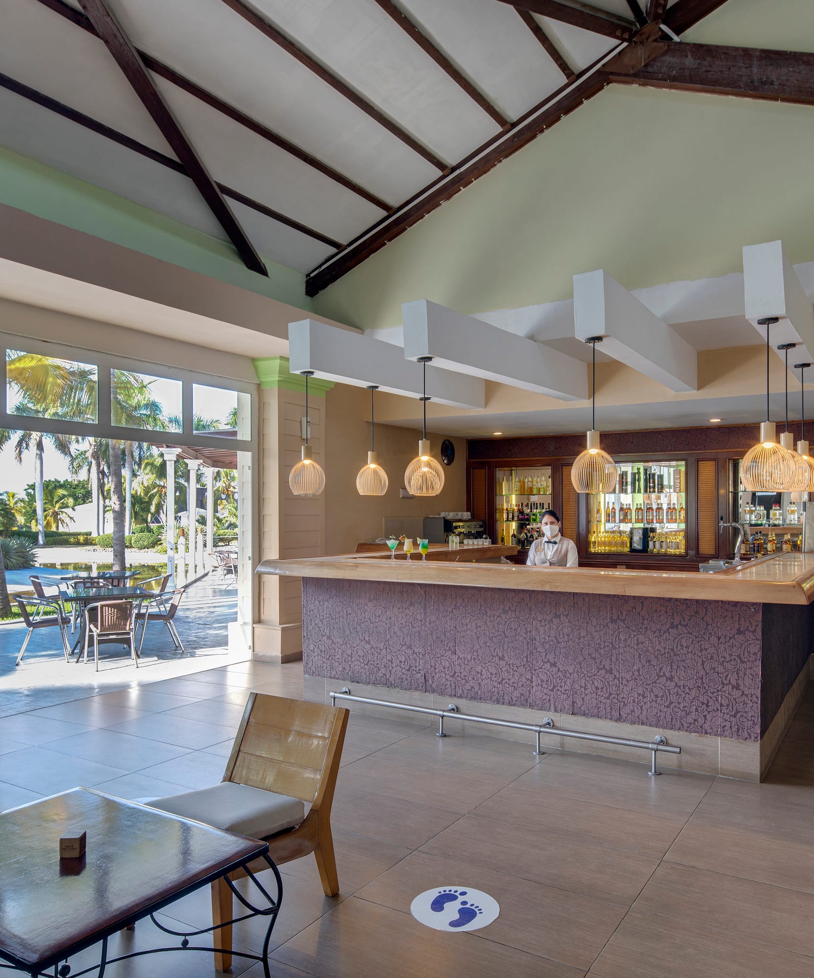 a room with a bar and a table