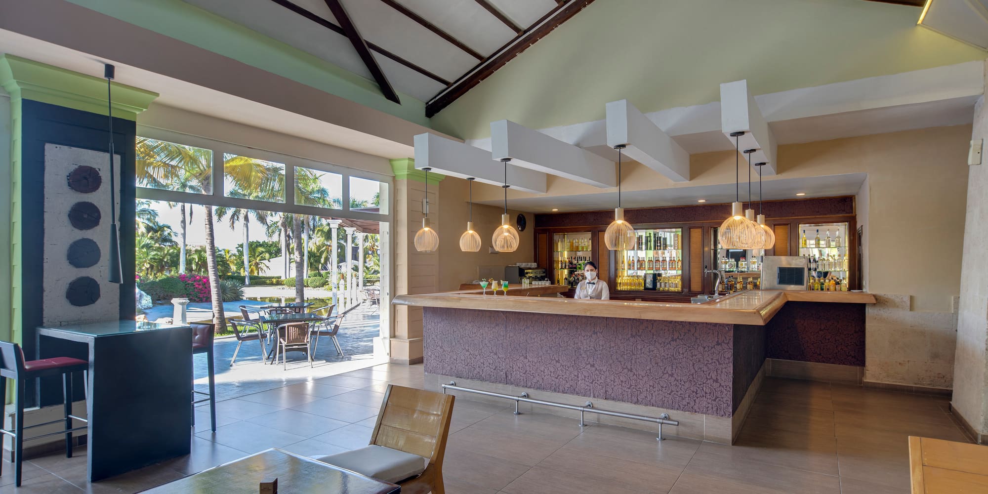 a room with a bar and a table