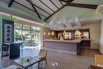 a room with a bar and a table