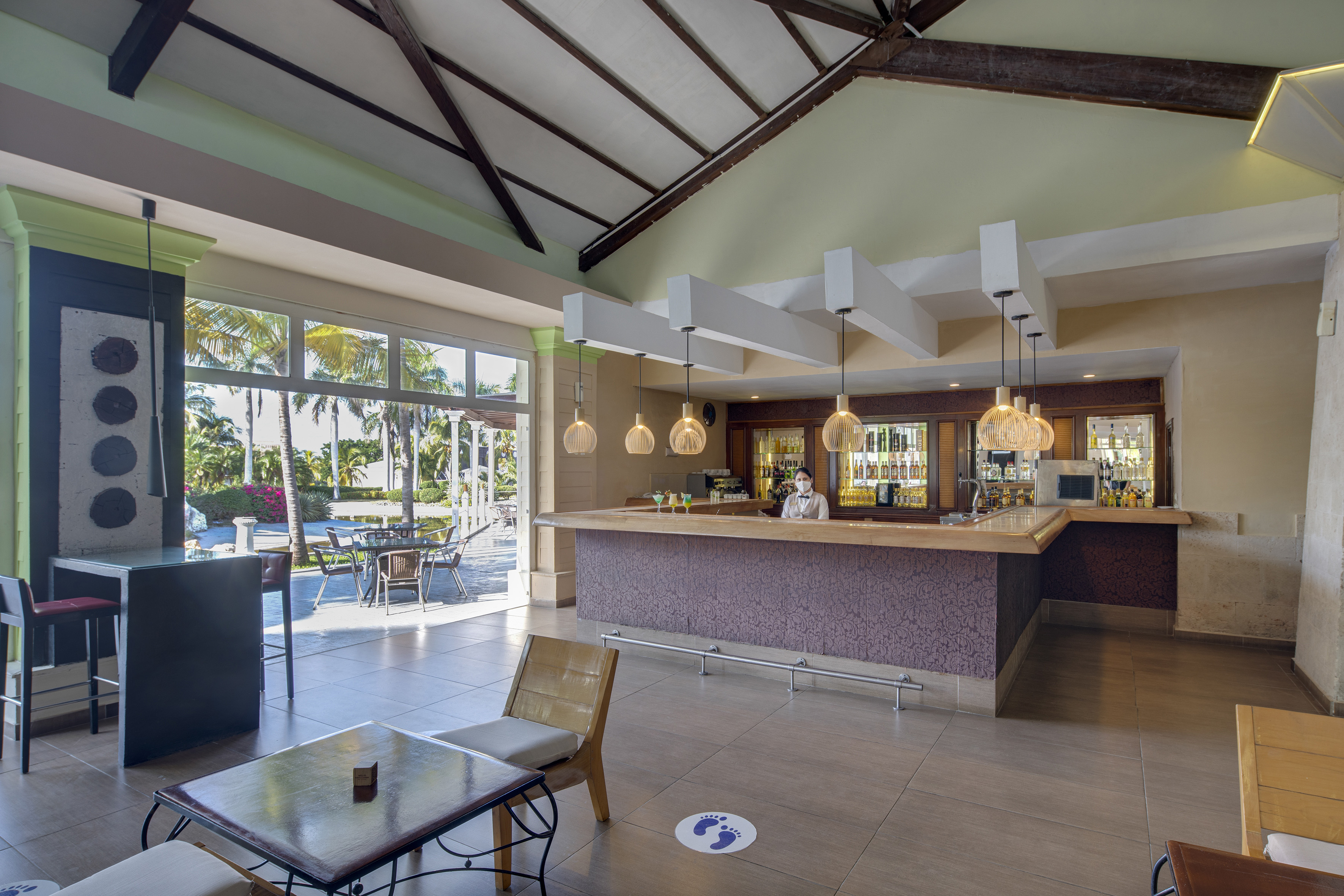 a room with a bar and a table