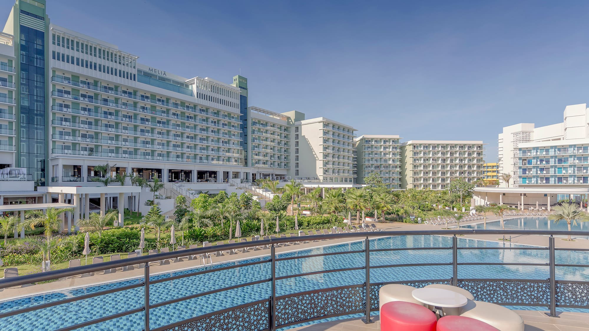 a pool with a large building in the background