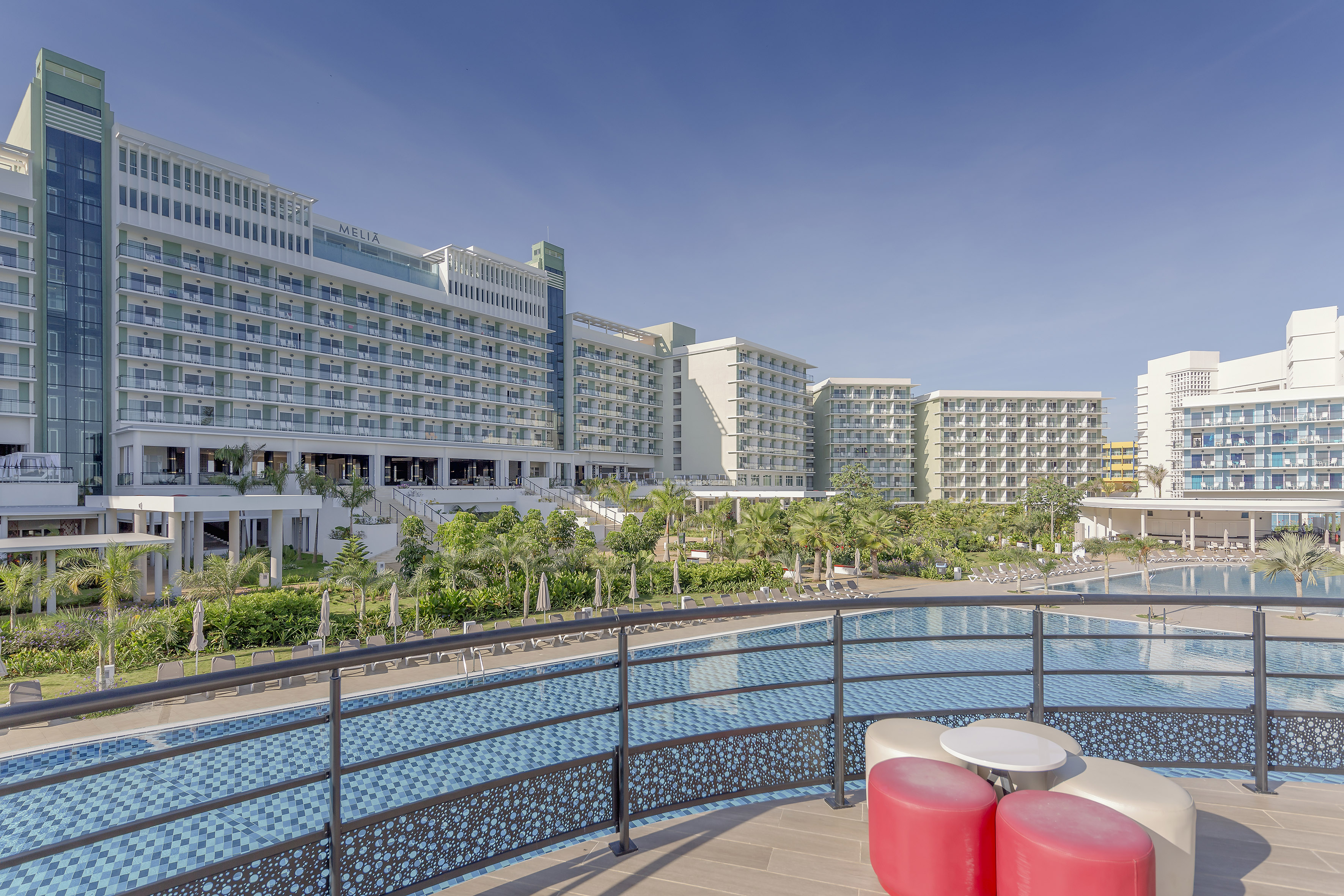 a pool with a large building in the background