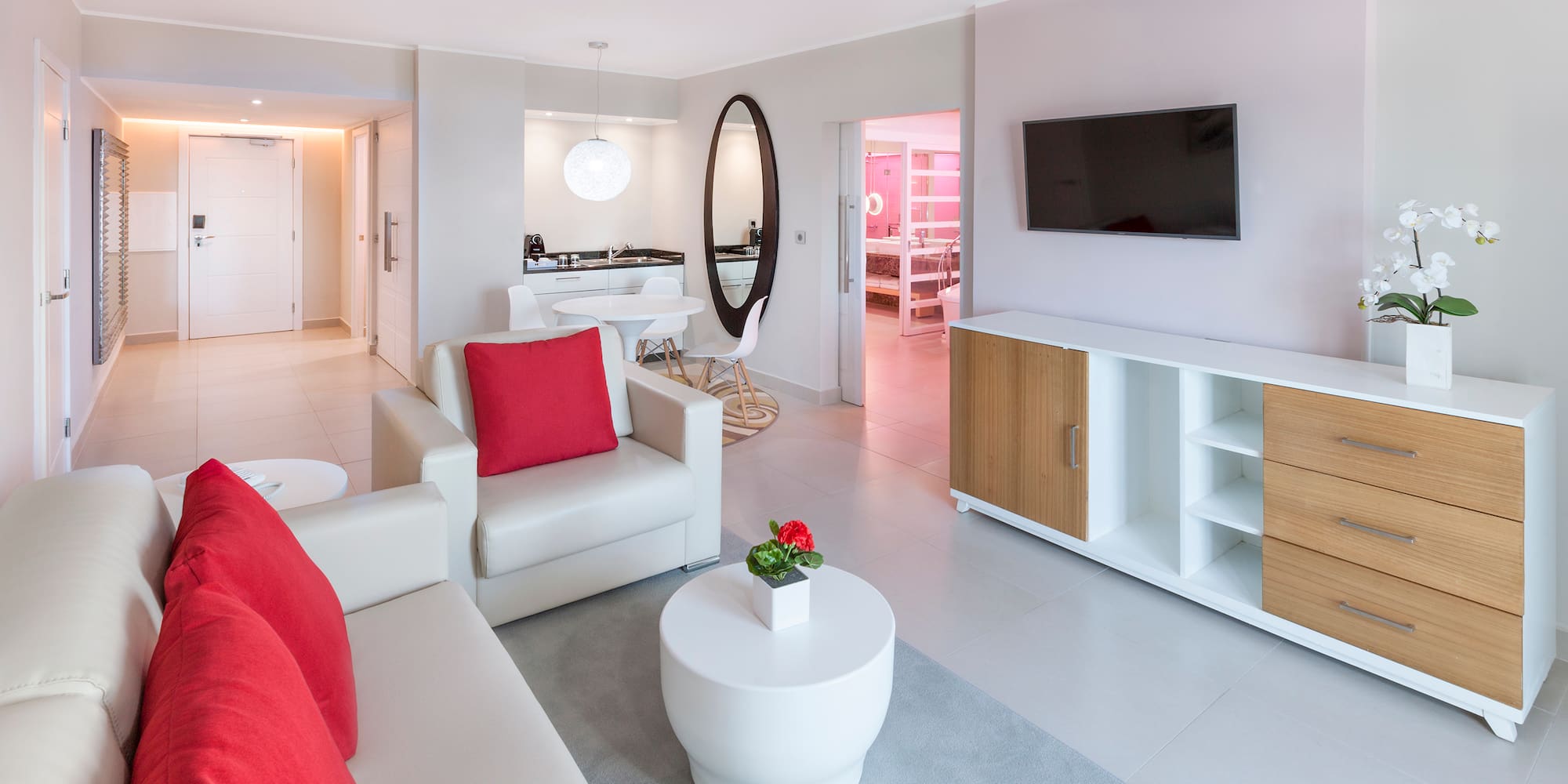 a living room with a television and a couch