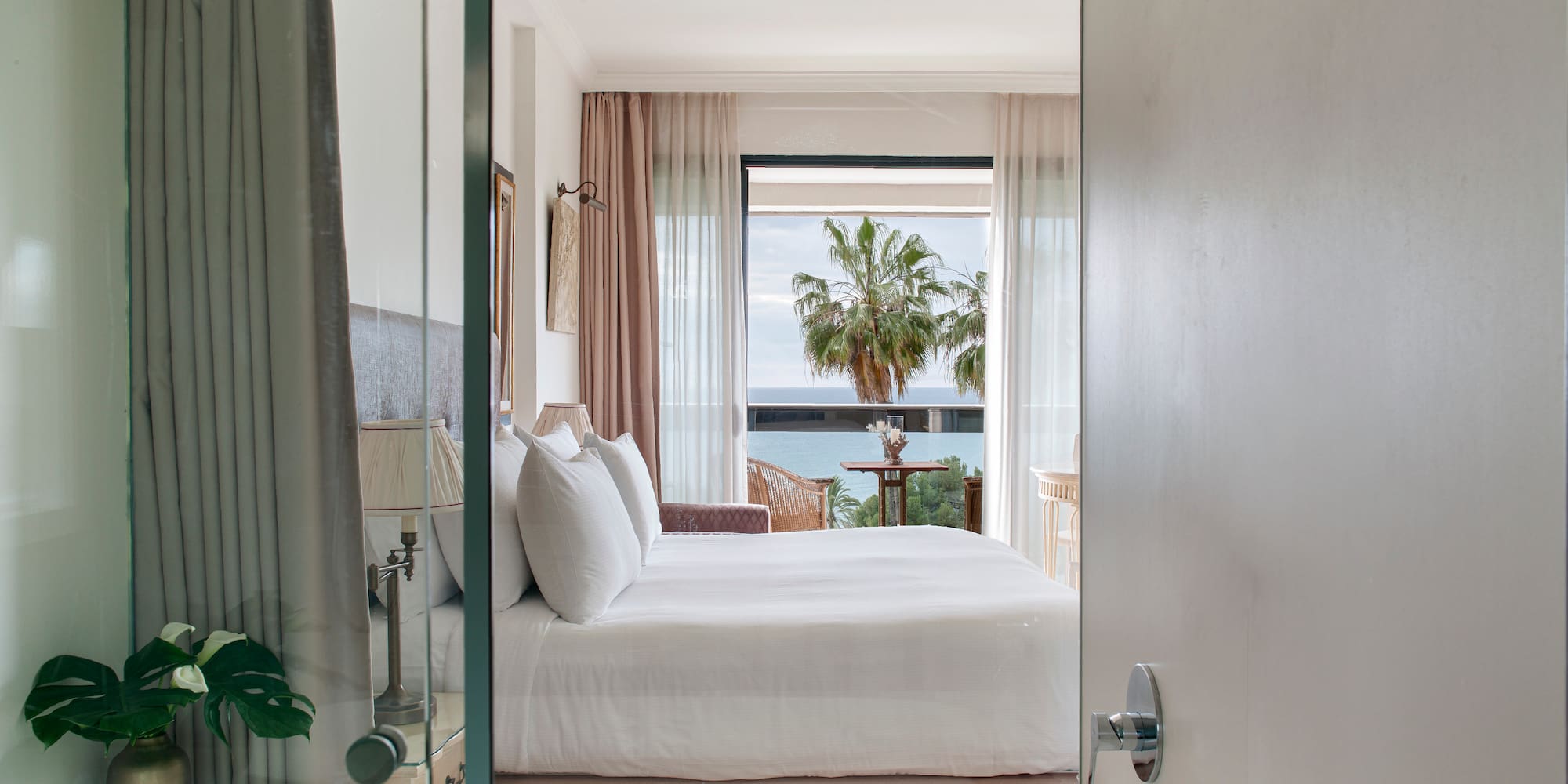 a bedroom with a bathtub and a bed