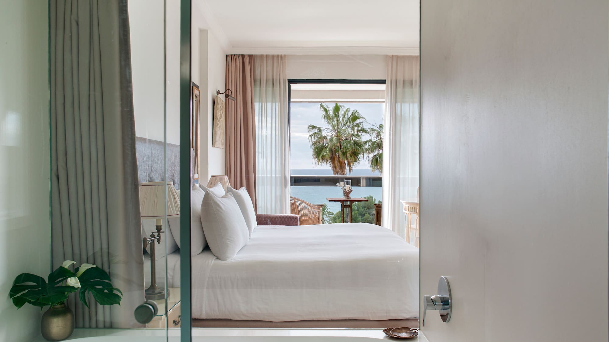 a bedroom with a bathtub and a bed