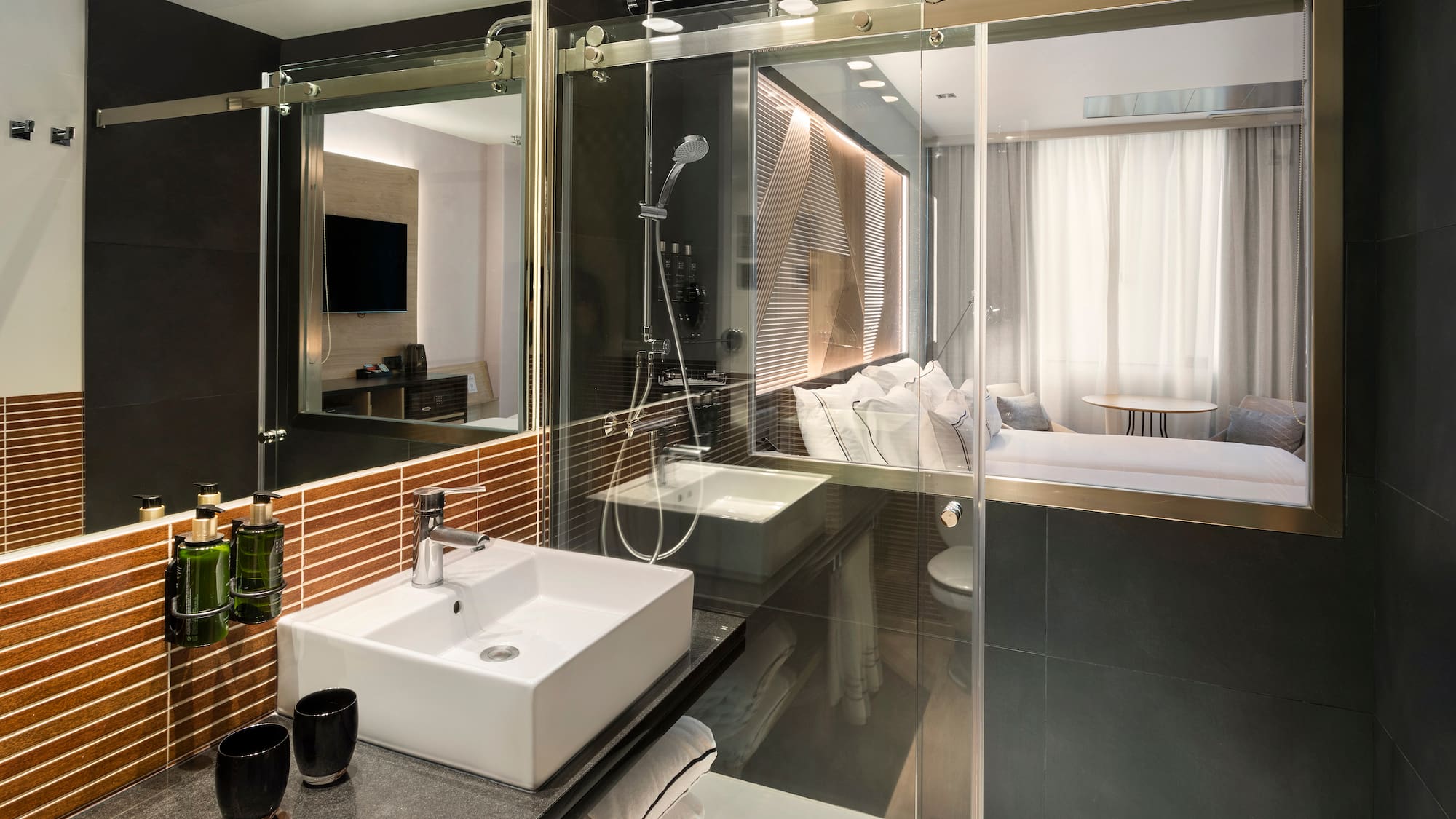 a bathroom with a glass shower door
