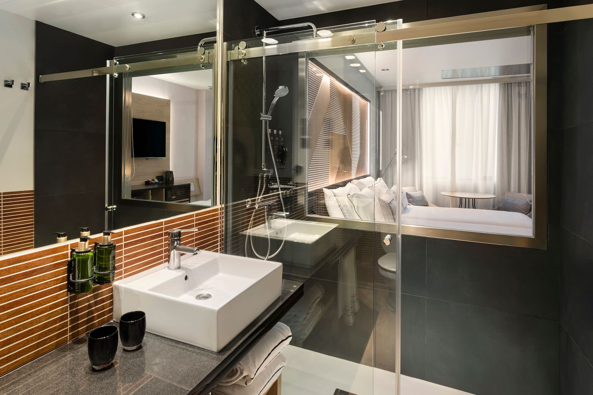 a bathroom with a glass shower door