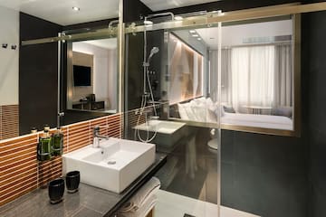 a bathroom with a glass shower door