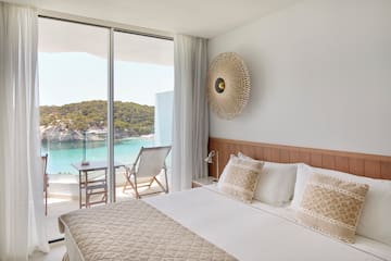 a bed with a view of the ocean