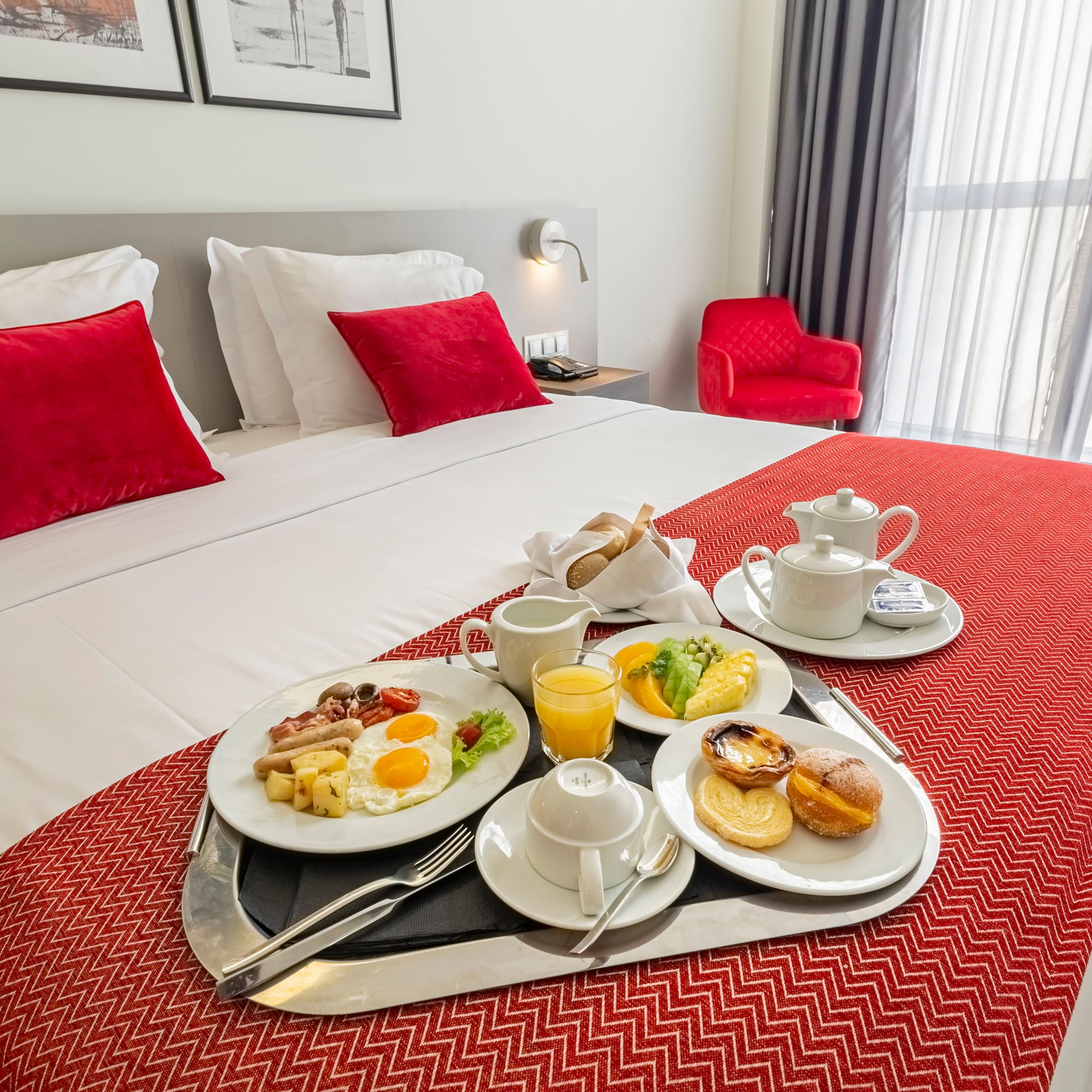a tray of breakfast on a bed