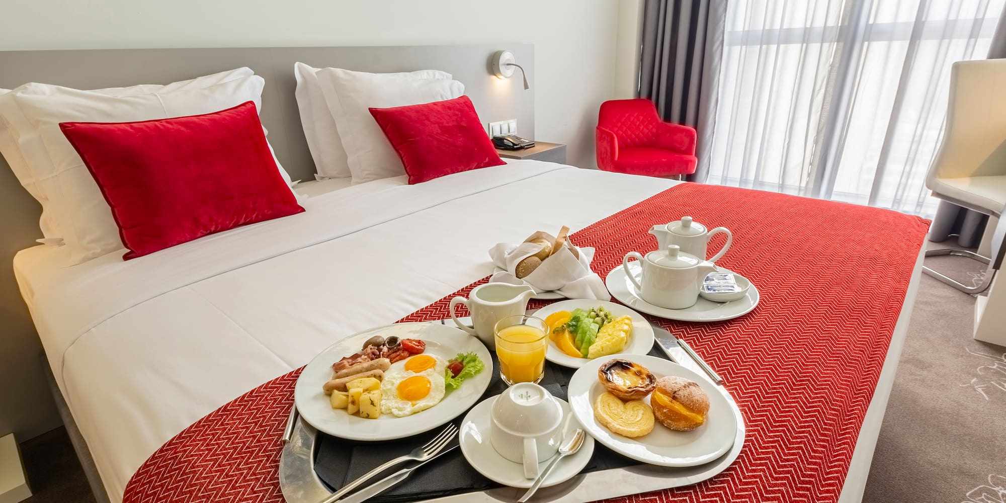 a tray of breakfast on a bed