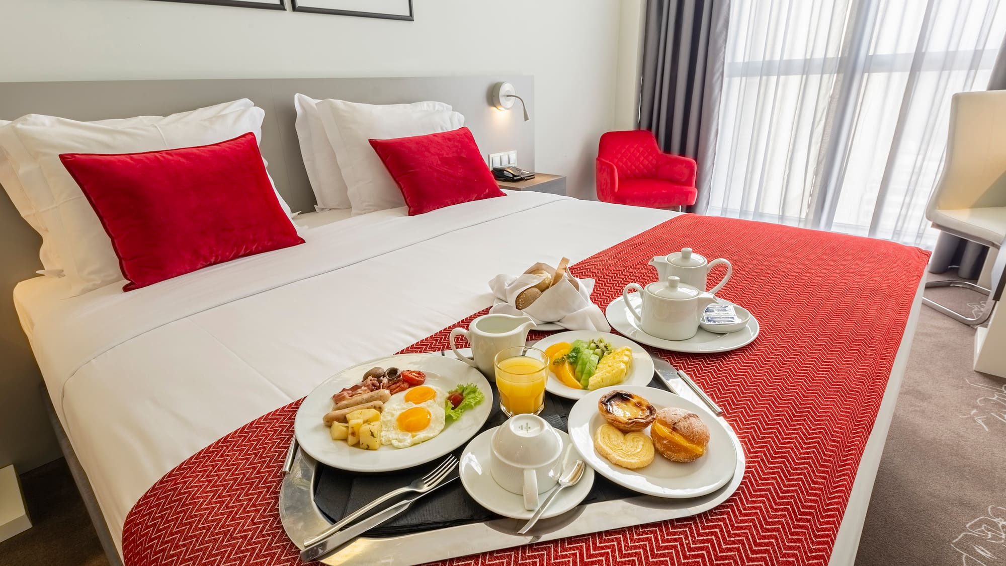 a tray of breakfast on a bed