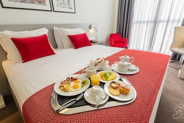 a tray of breakfast on a bed