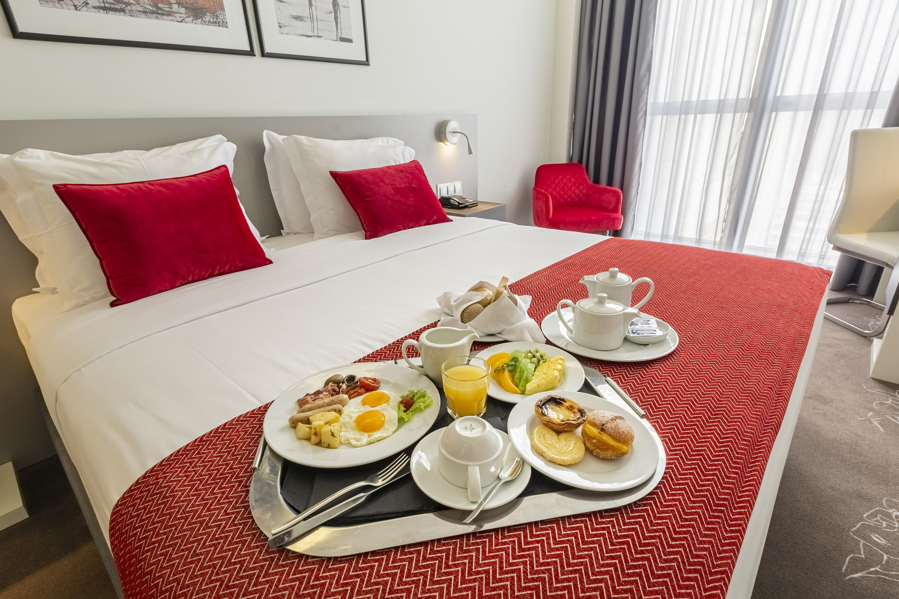 a tray of breakfast on a bed