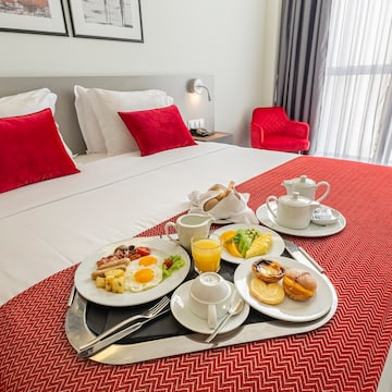 a tray of breakfast on a bed