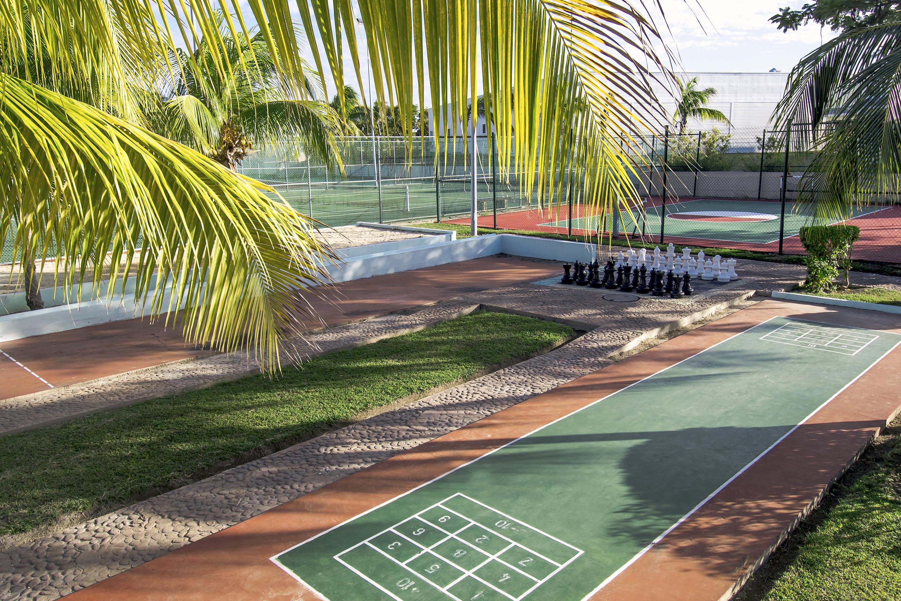 a tennis court with a game of chess