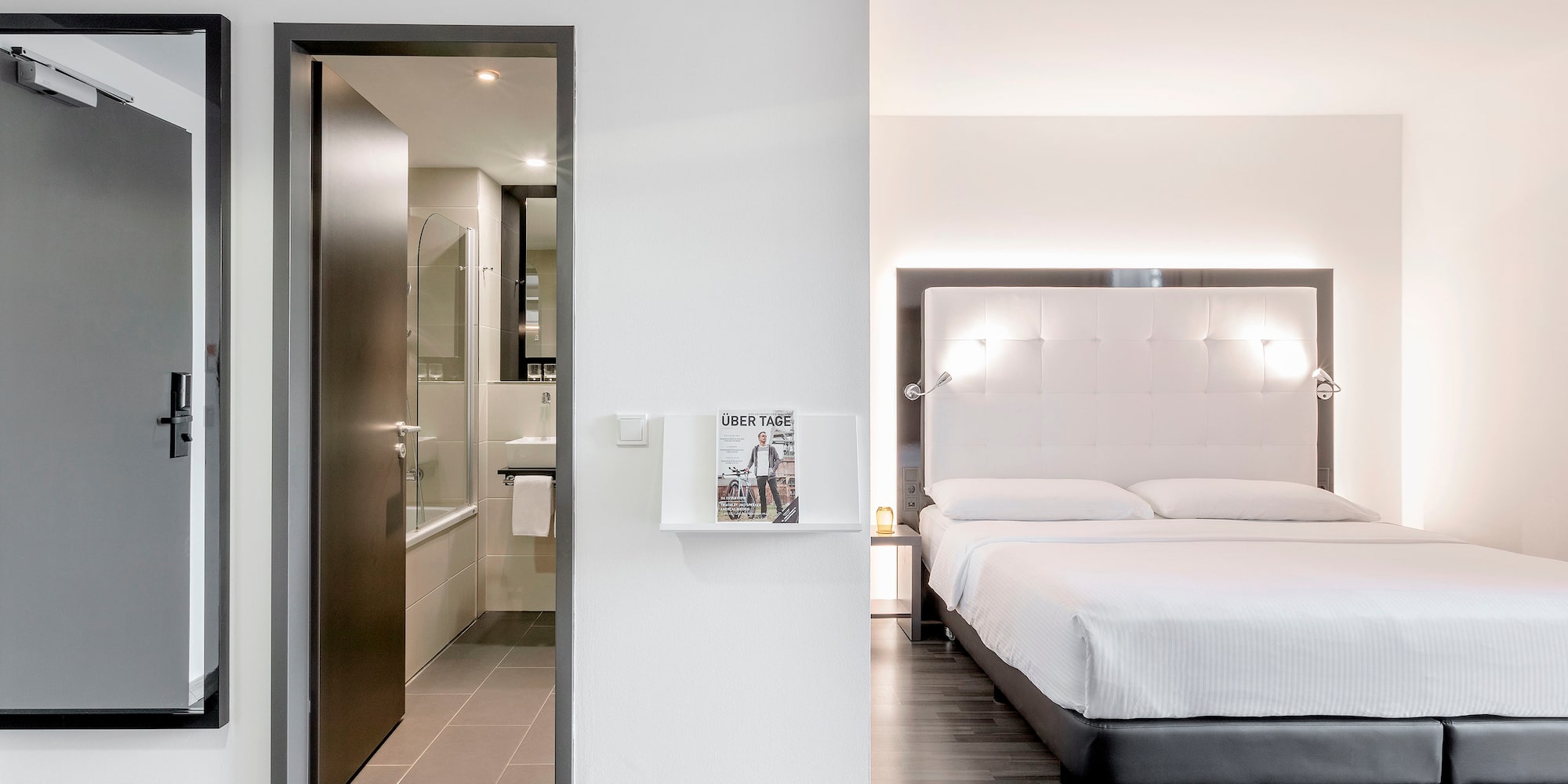 a bedroom with a bed and a shower