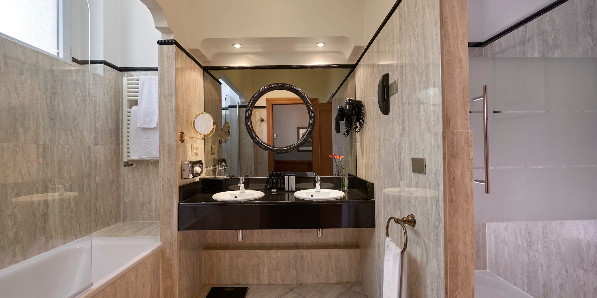 a bathroom with marble walls and a sink