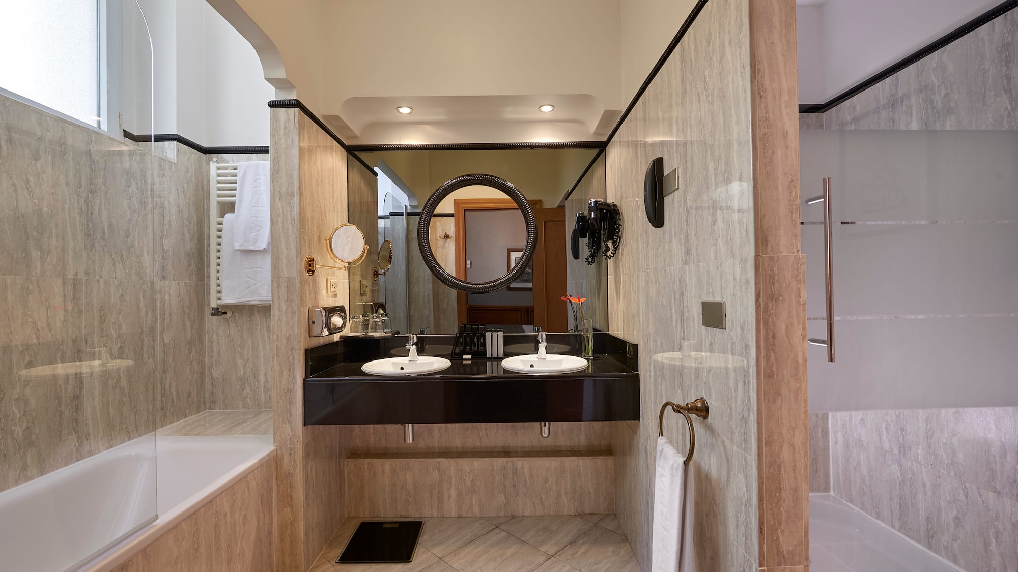 a bathroom with marble walls and a sink