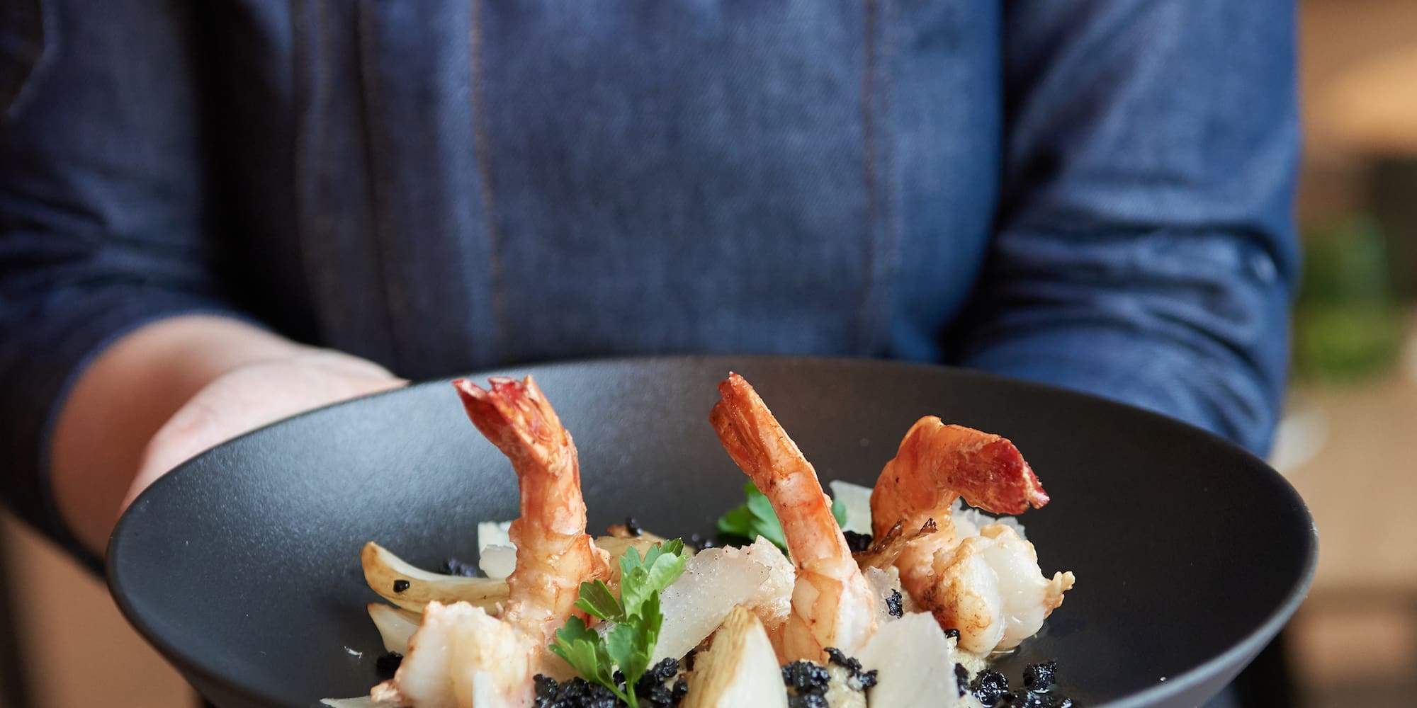 a person holding a plate of food