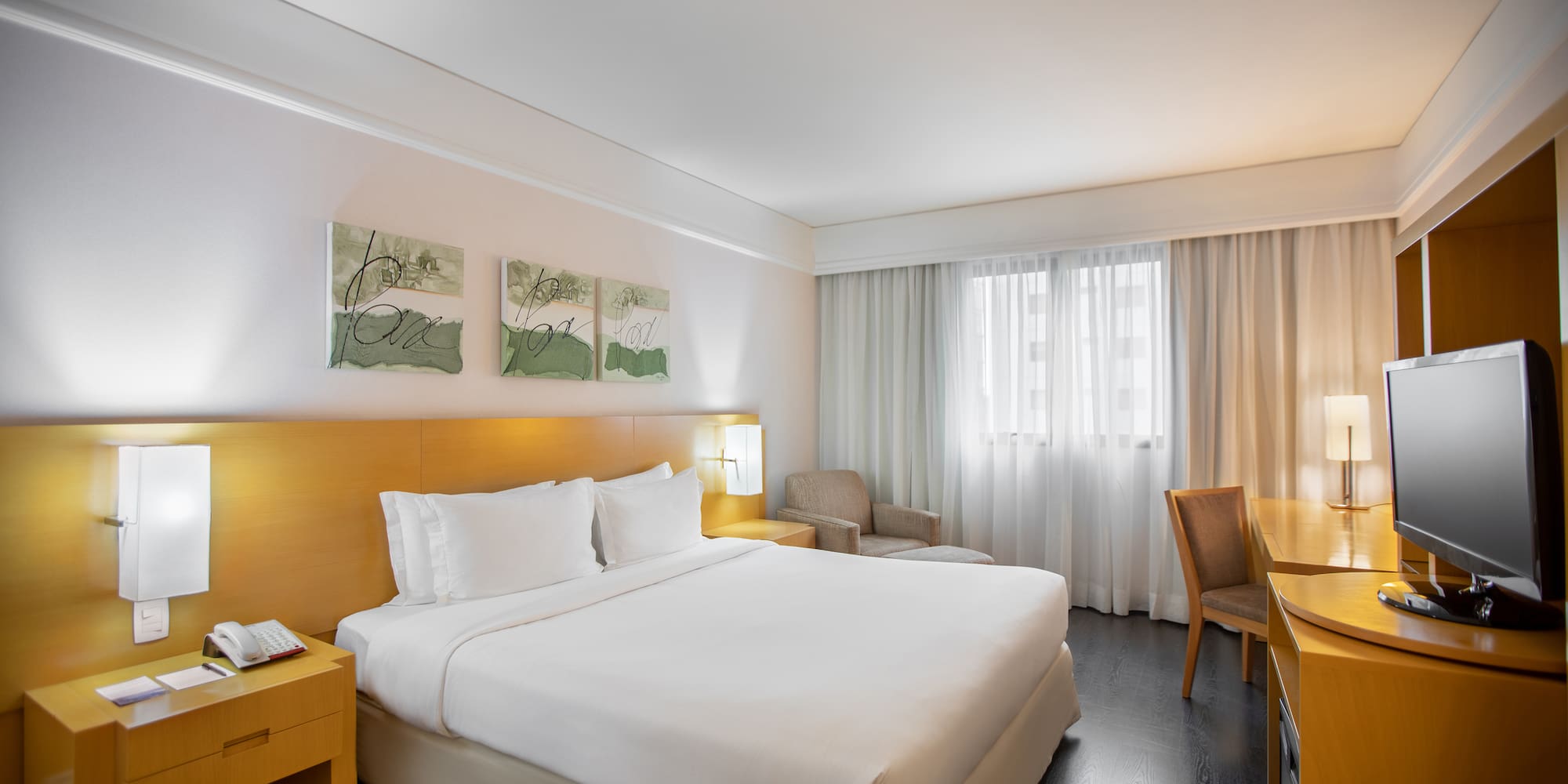 a hotel room with a bed and a table