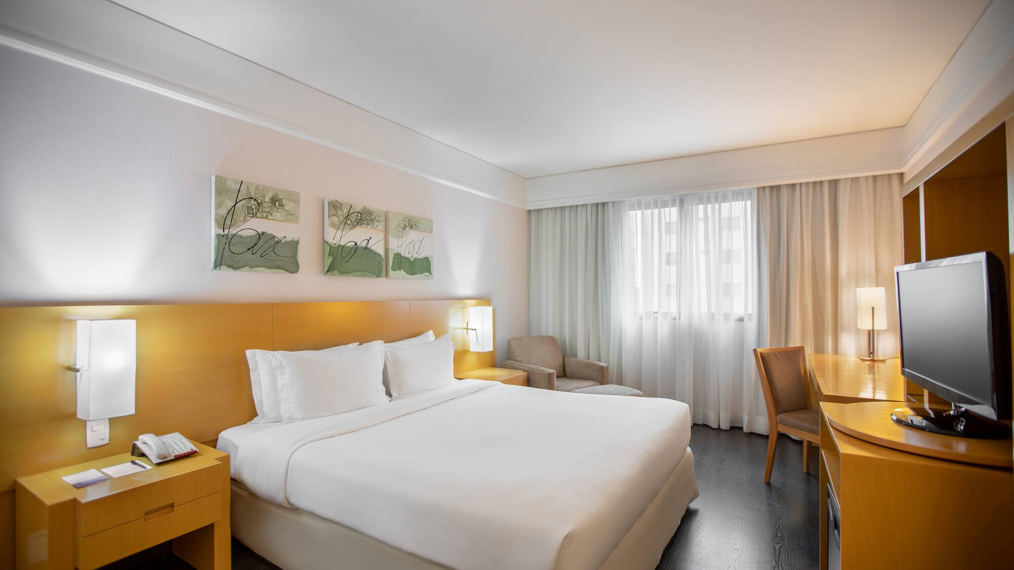 a hotel room with a bed and a table