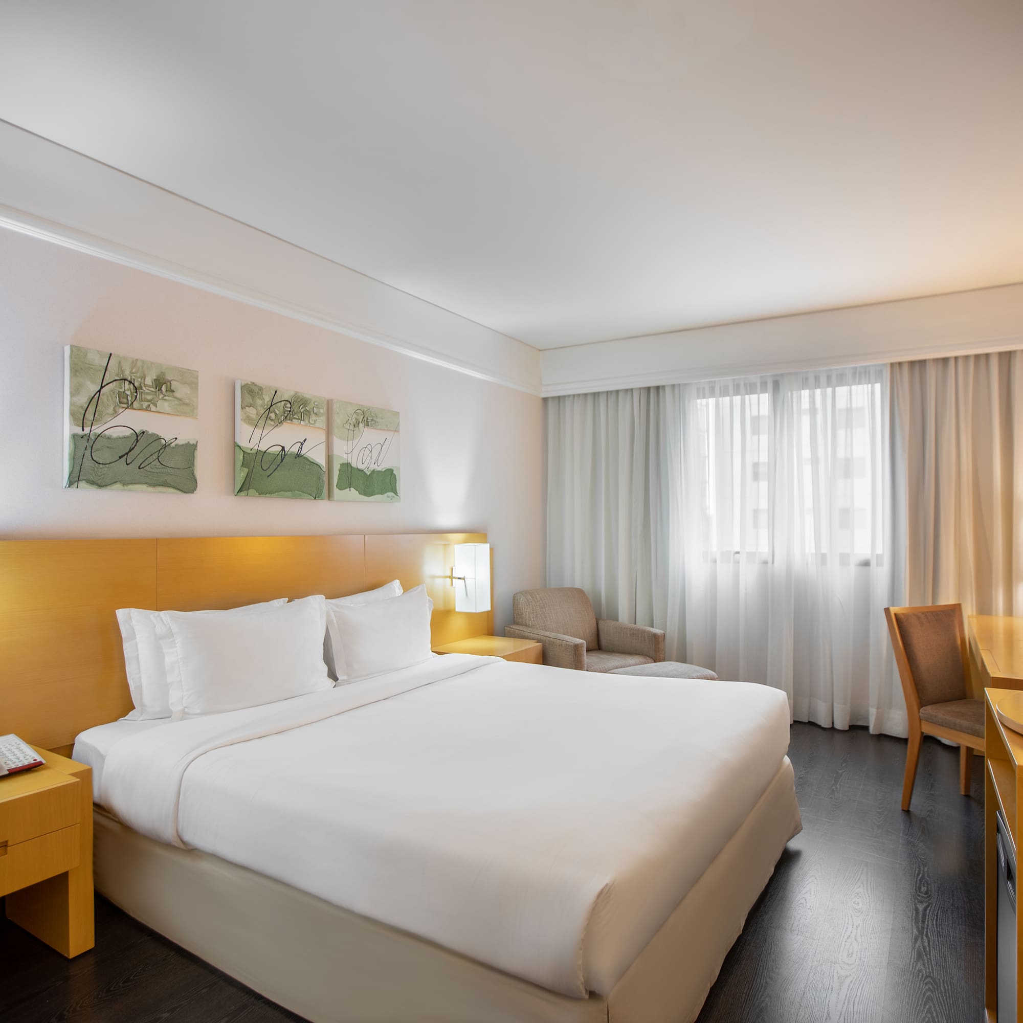 a hotel room with a bed and a table