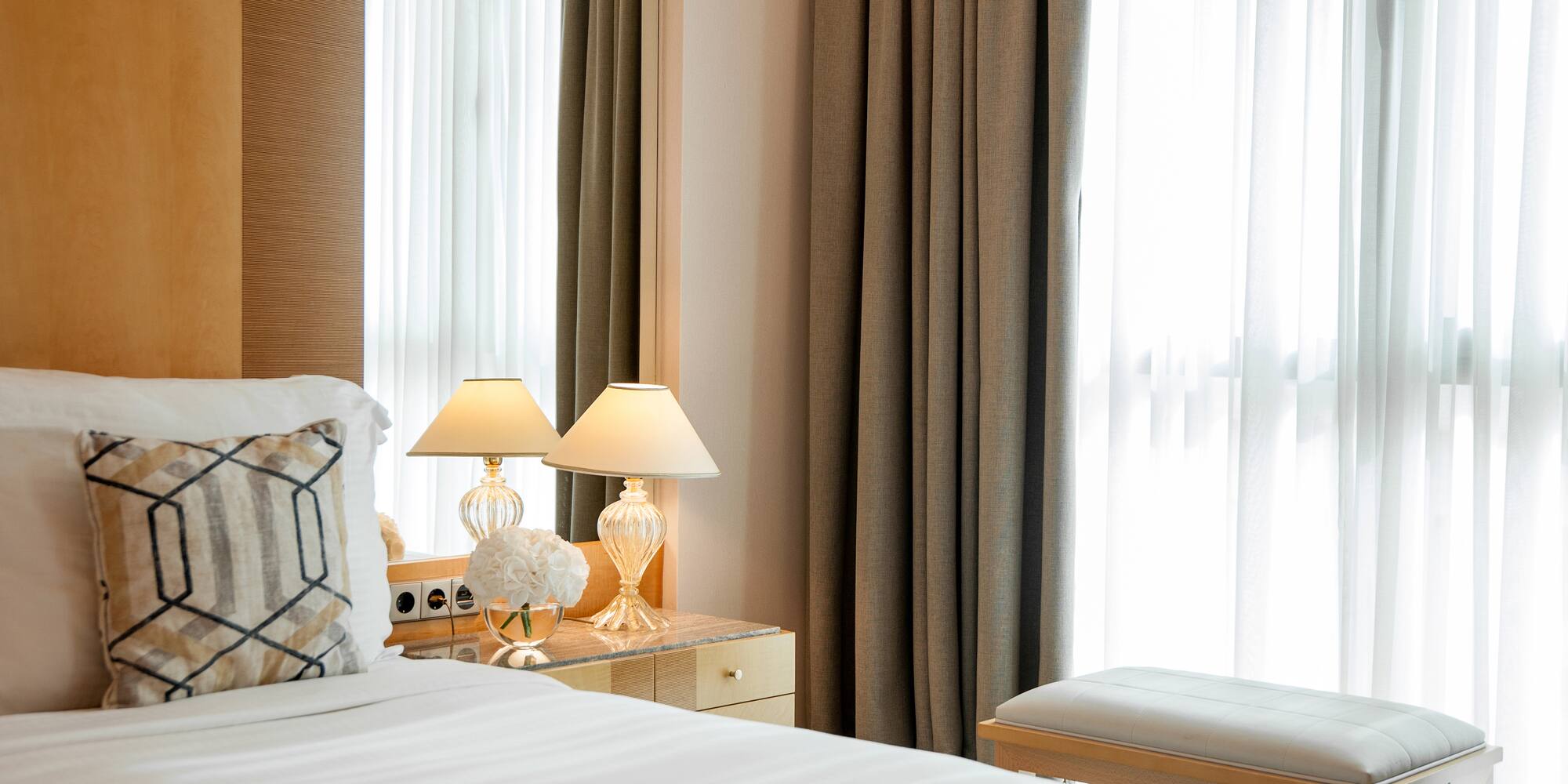 a bedroom with a bed and a bench