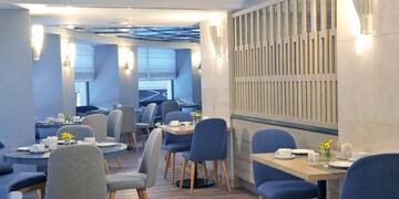 a room with tables and chairs