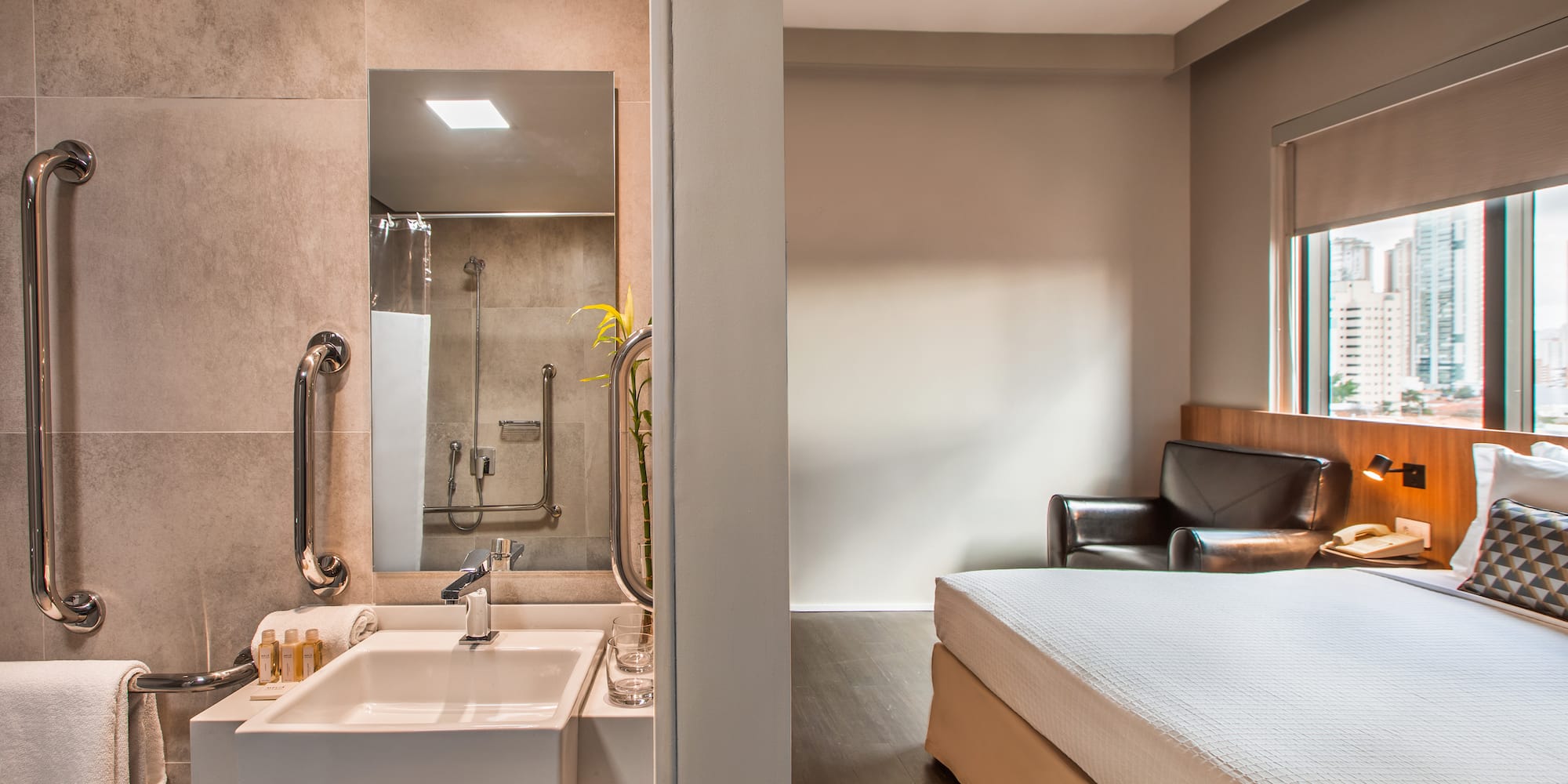 a bathroom with a bed and sink