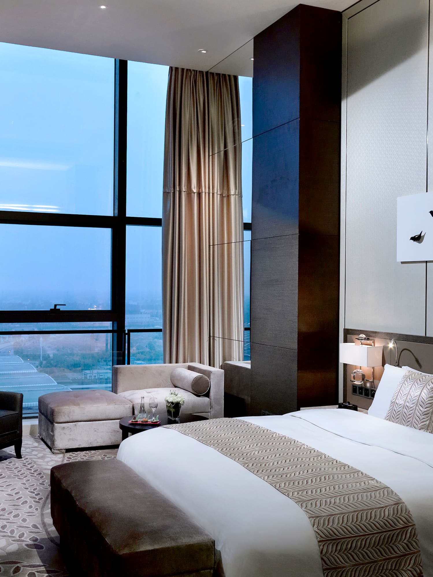 a bedroom with a large window