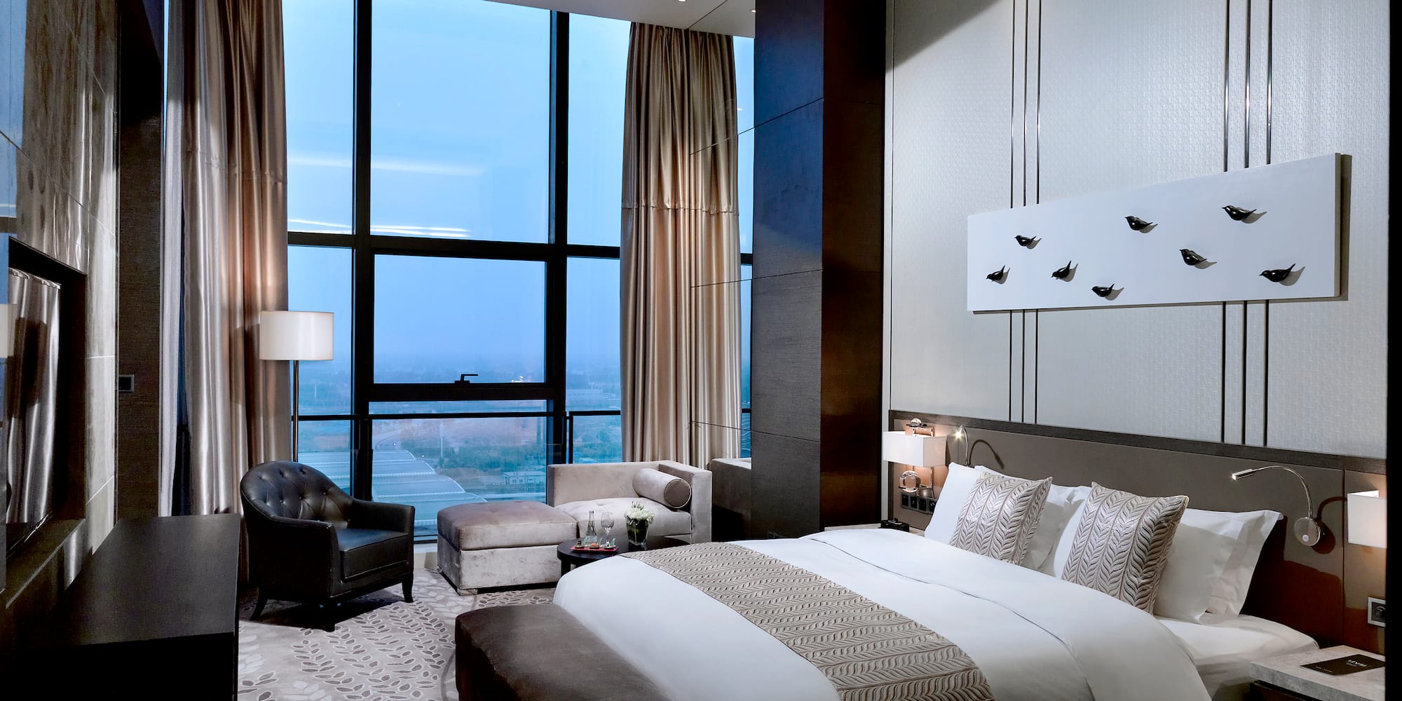 a bedroom with a large window