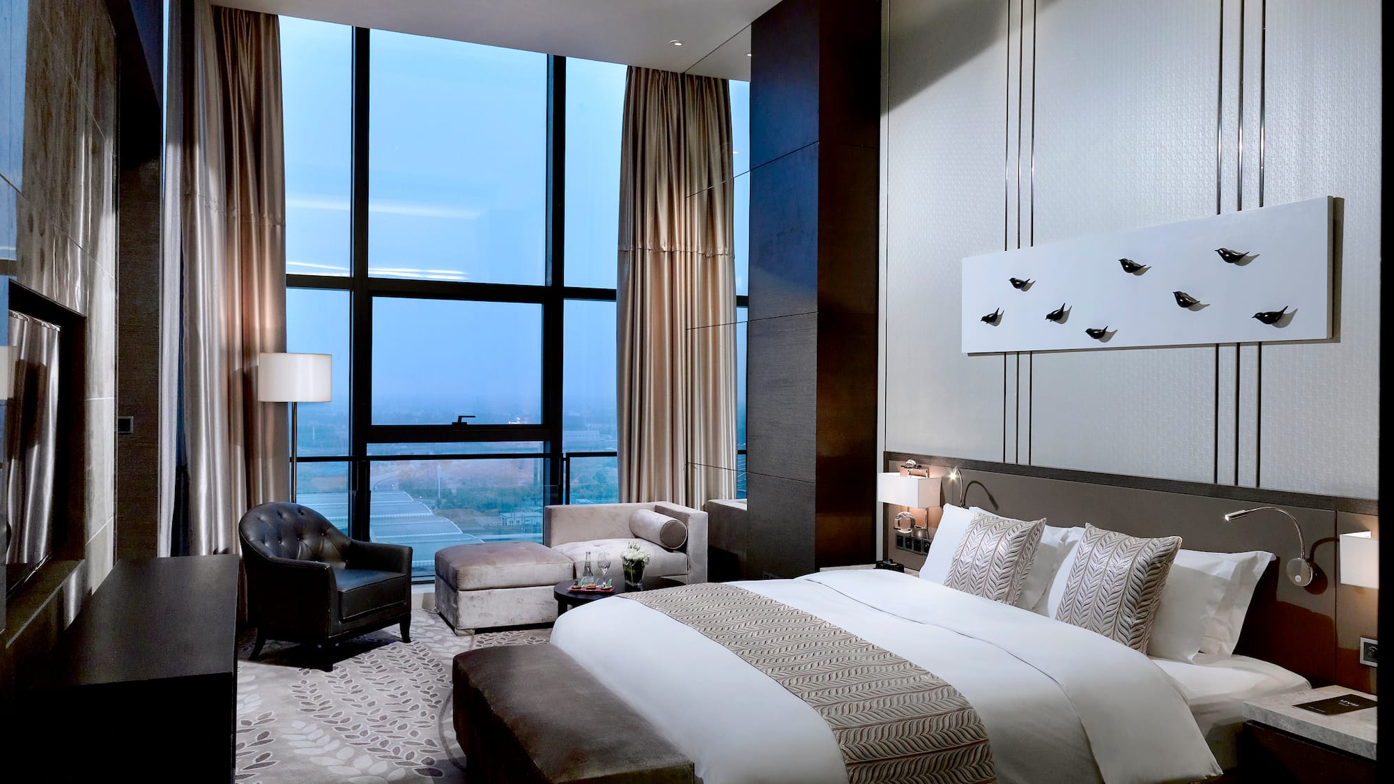 a bedroom with a large window