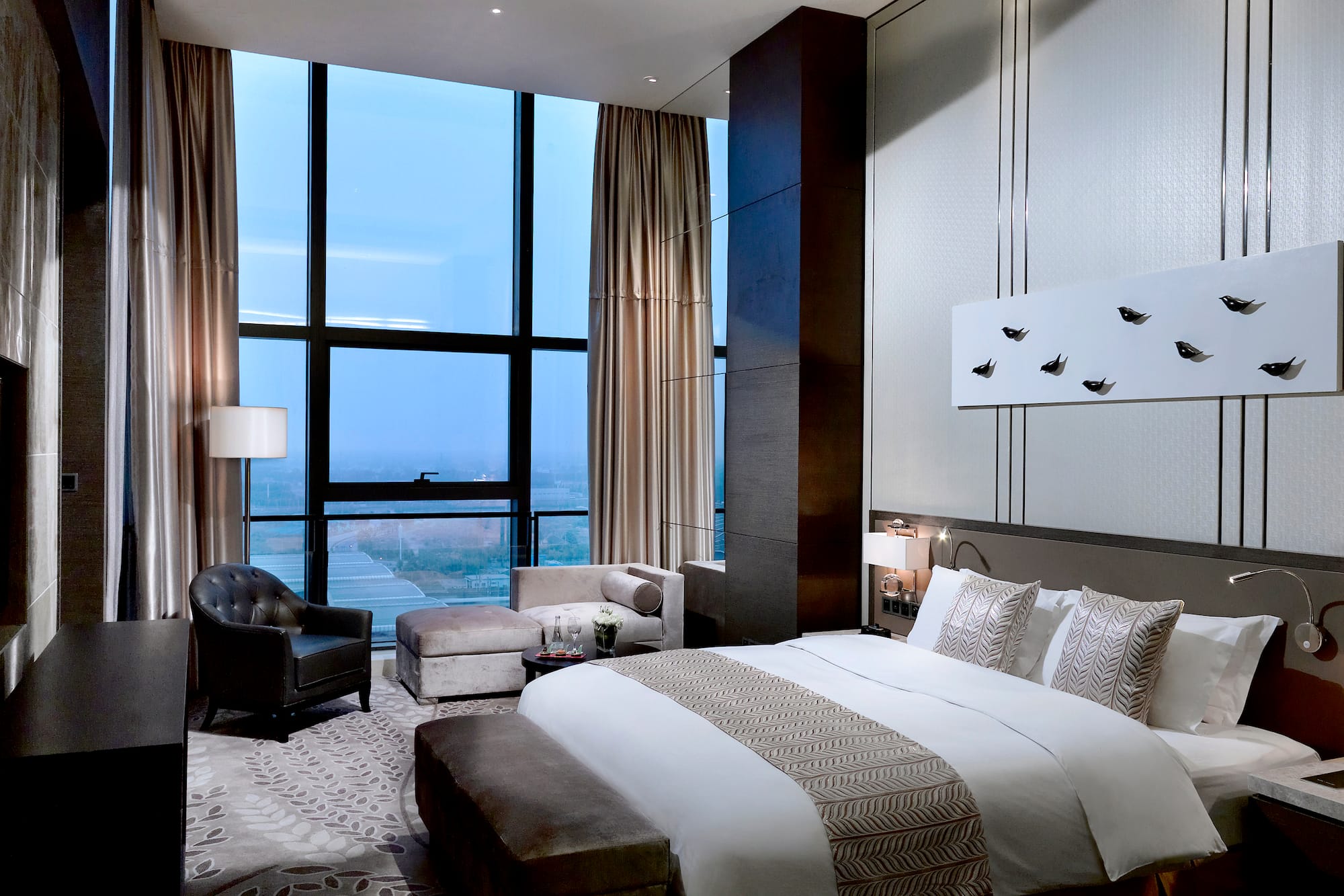 a bedroom with a large window