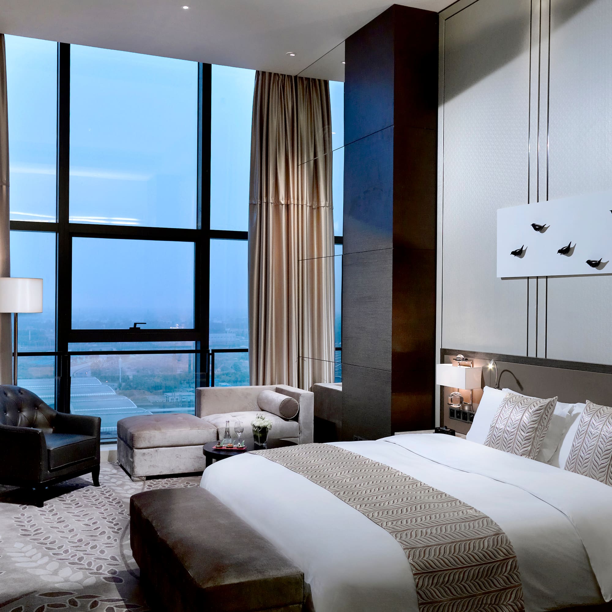 a bedroom with a large window