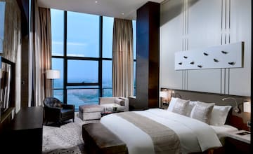 a bedroom with a large window