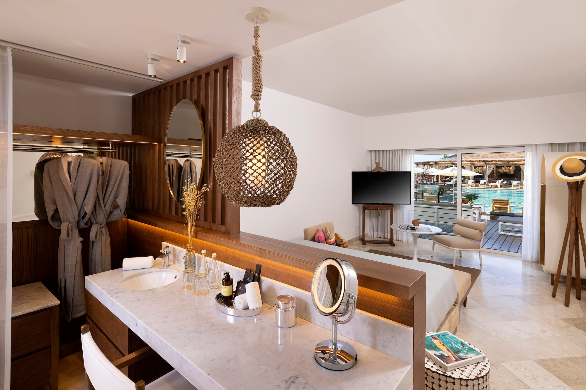 a bathroom with a mirror and a bed