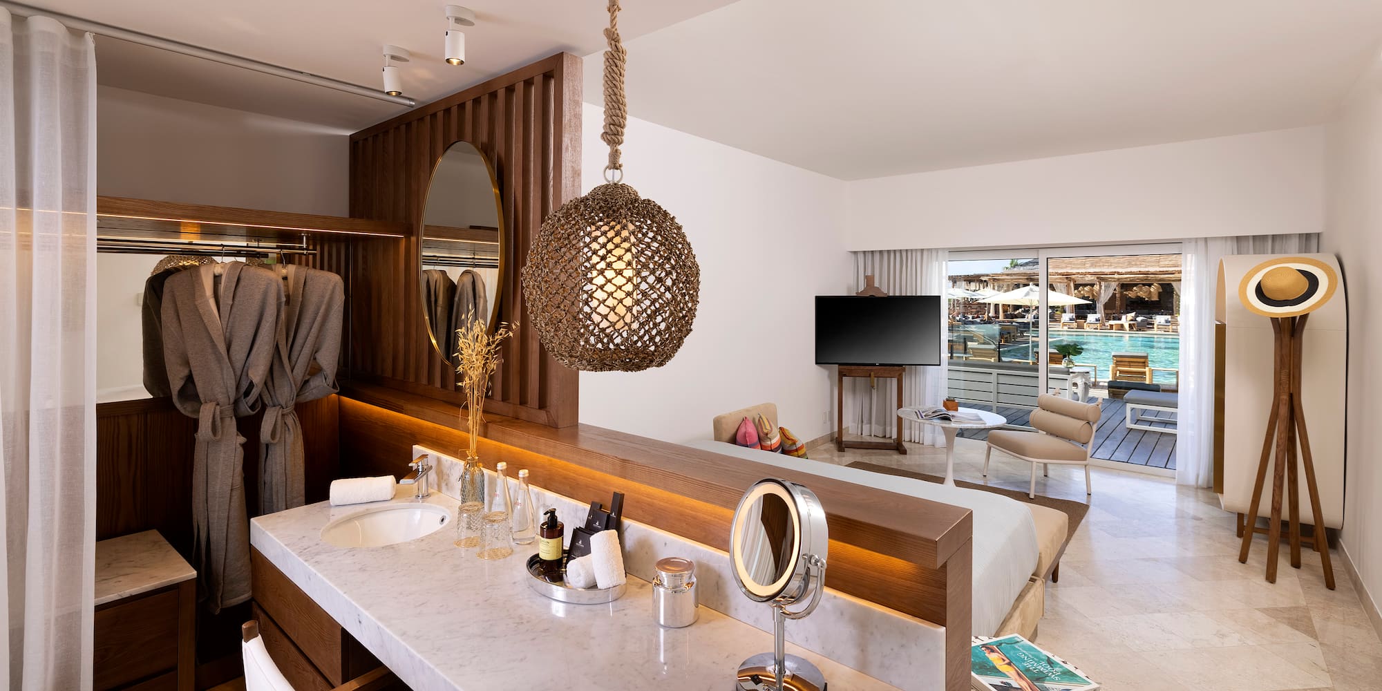 a bathroom with a mirror and a bed