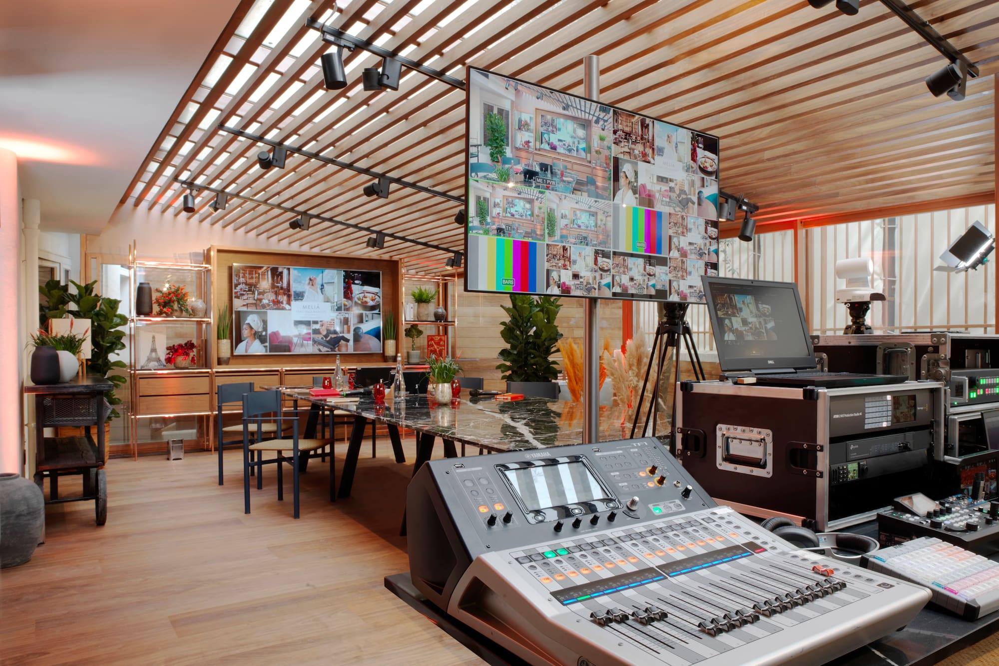 a room with a large screen and a large television