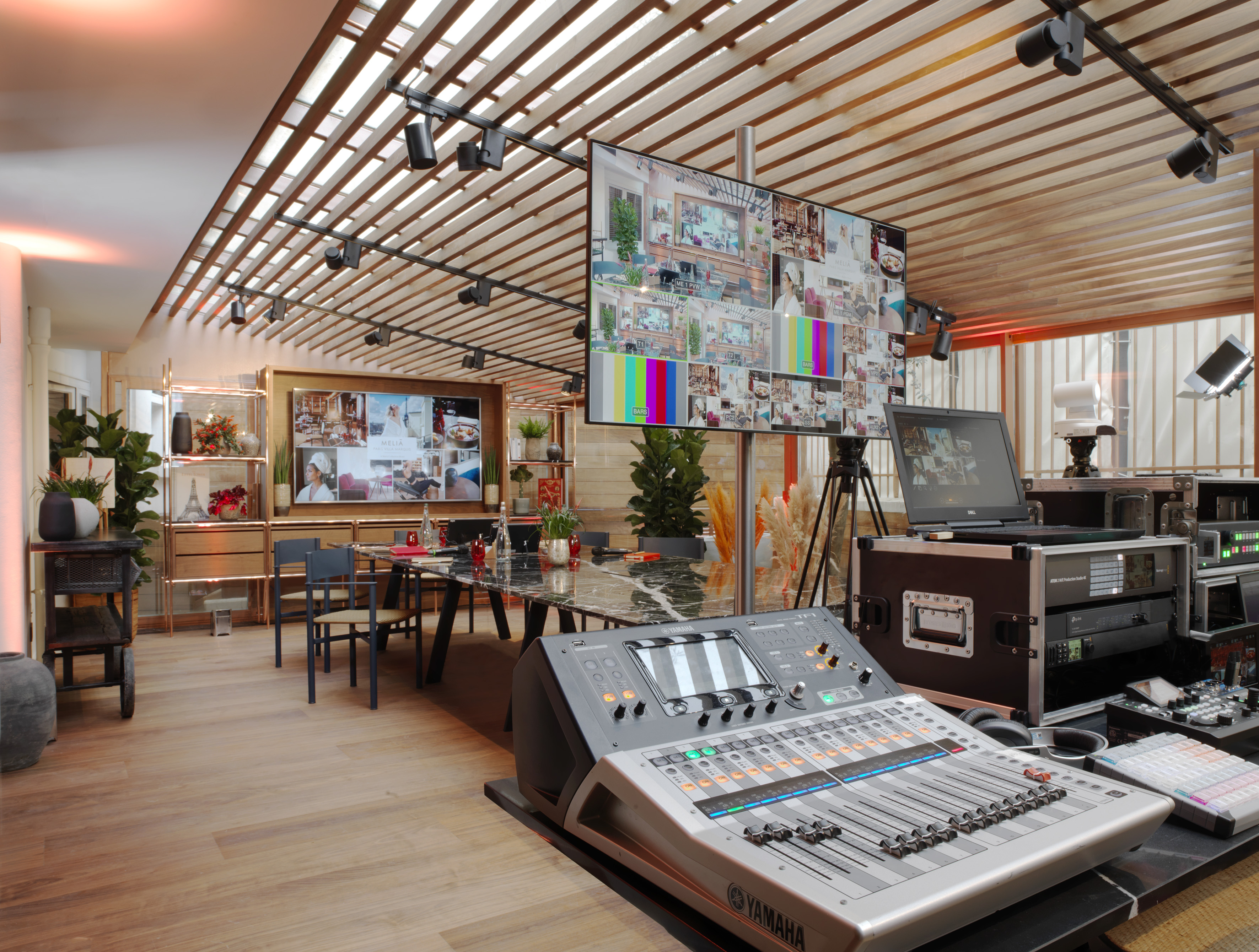 a room with a large screen and a large television